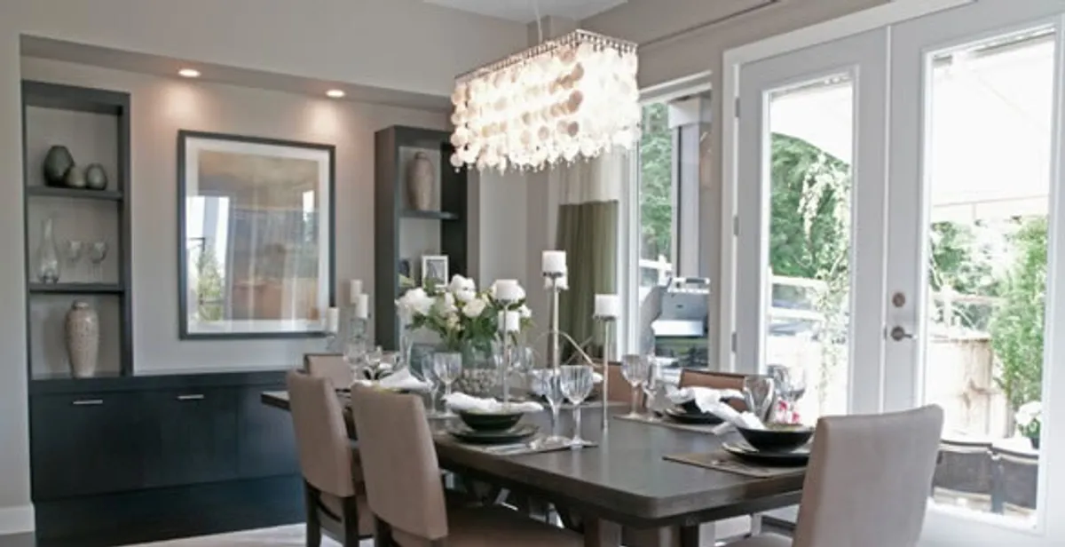Elegant dining room chandelier installation above table in Redding, CA