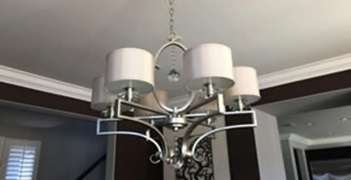 Modern chandelier installation with multiple light fixtures in Redding, CA